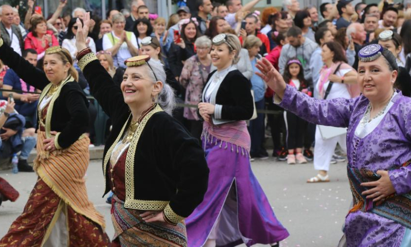 People in folk costumes participate in the Rose Festival parade in Kazanlak, Bulgaria, June 4, 2023. A parade took place here on Sunday during the 2023 Rose Festival. Kazanlak is known for its Rose Festival, which has been organized since 1903. (Xinhua/Lin Hao)