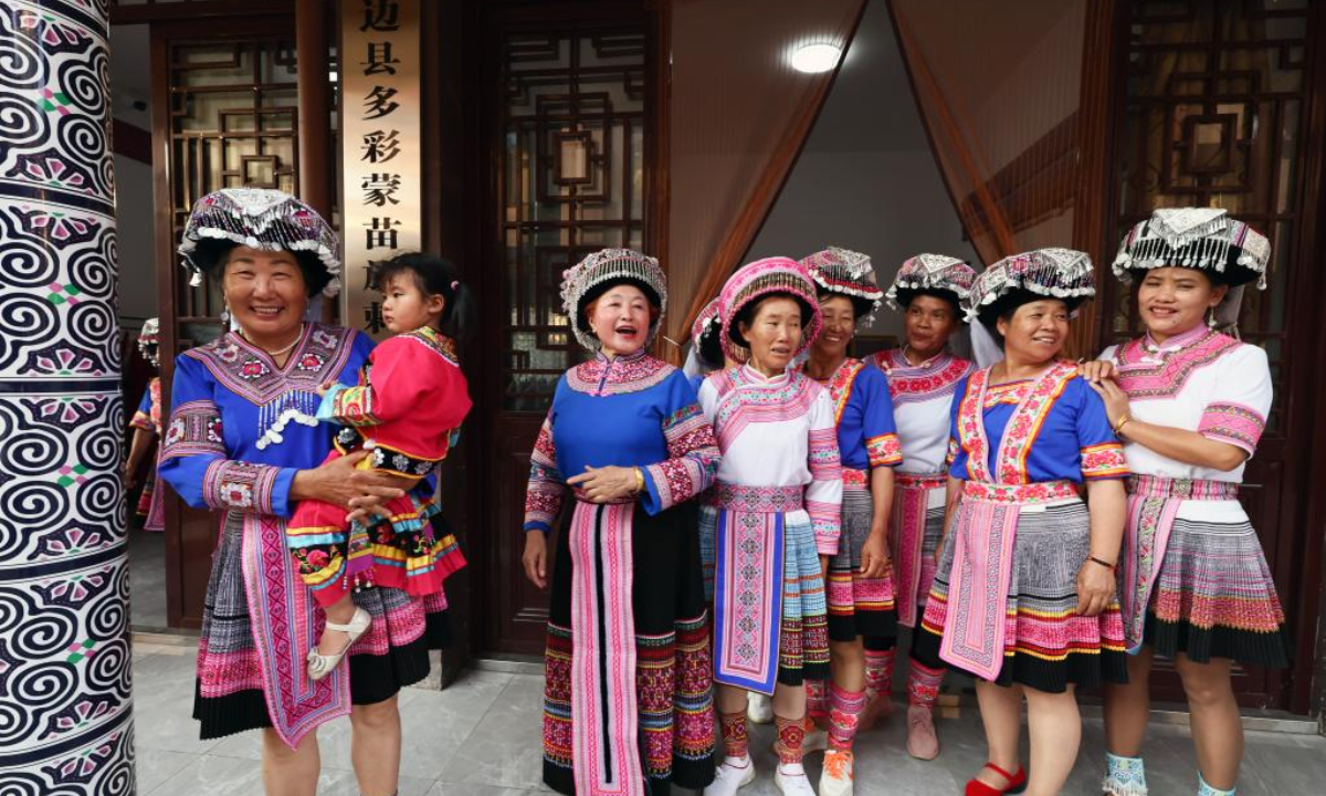 Women of Miao ethnic group pose for a group photo at an embroidery workshop in Pingbian Miao Autonomous County, southwest China's Yunnan Province, June 1, 2023. Pingbian Miao Autonomous County has been making efforts to support and develop its embroidery industry, trying to provide job opportunities to local women. Photo:Xinhua