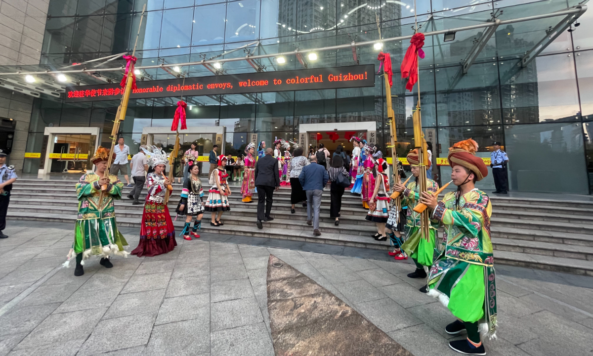 Diplomats from countries including Yemen, Cyprus, Greece, and Malta are welcomed by Miao and other ethnic minorities at the Guiyang Theatre. Photo: Liu Caiyu/GT