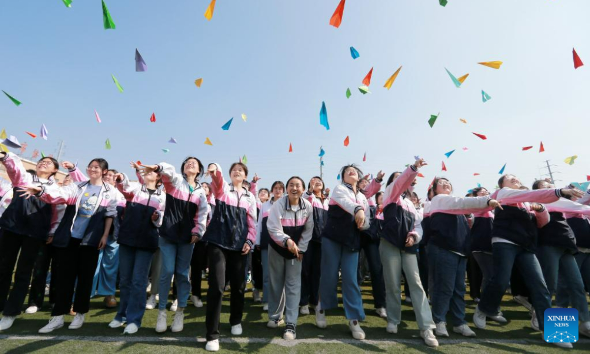 High school seniors take part in a stress relief game in Huaibei, east China's Anhui Province, May 31, 2023. As this year's college entrance exam approaches, a high school in Huaibei organized a series of activities to help students release stress. Photo:Xinhua