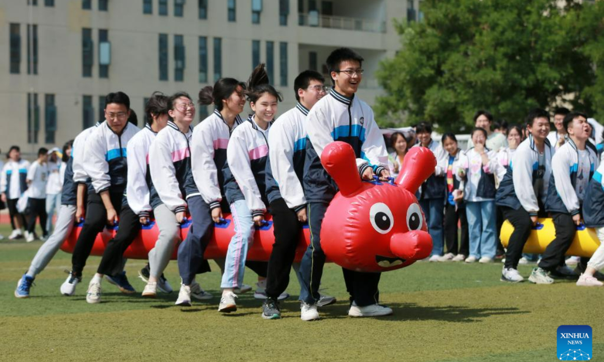 High school seniors take part in a stress relief game in Huaibei, east China's Anhui Province, May 31, 2023. As this year's college entrance exam approaches, a high school in Huaibei organized a series of activities to help students release stress. Photo:Xinhua