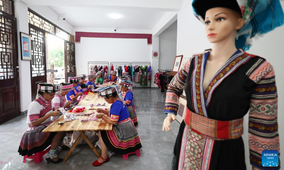 Women of Miao ethnic group make embroidery works at a workshop in Pingbian Miao Autonomous County, southwest China's Yunnan Province, June 1, 2023. Pingbian Miao Autonomous County has been making efforts to support and develop its embroidery industry, trying to provide job opportunities to local women. Photo:Xinhua