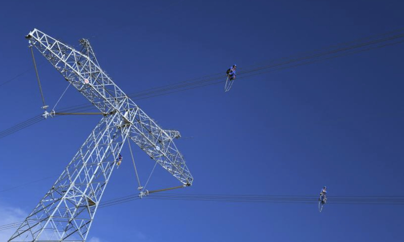 Workers conduct routing inspection of power transmission lines at Tanggulashan Township of Golmud City in the Mongolian-Tibetan Autonomous Prefecture of Haixi, northwest China's Qinghai Province, June 3, 2023. Since 2012, the State Grid's Qinghai Electricity Power Company would conduct its annual centralized maintenance of the Qinghai-Tibet grid interconnection project, whose grid lines are laid at the plateau with an average altitude of 4,500 meters. Low temperatures, lack of oxygen and strong winds on the plateau challenge the operation and maintenance of the grid.

Over 420 workers would finish this year's maintenance work of 608-kilometer-long power transmission lines as well as the Qaidam Converter Station in 15 days recently.

Over 10.5 billion kWh of electricity has been transferred to Tibet through the Qinghai-Tibet grid interconnection project, which was put into operation in 2011. (Photo by Pan Binbin/Xinhua)
