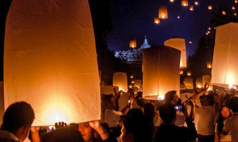 People release sky lanterns during the Vesak Day celebration at Borobudur temple in Magelang, Central Java, Indonesia, on June 4, 2023. (Photo by Agung Supriyantoo/Xinhua)