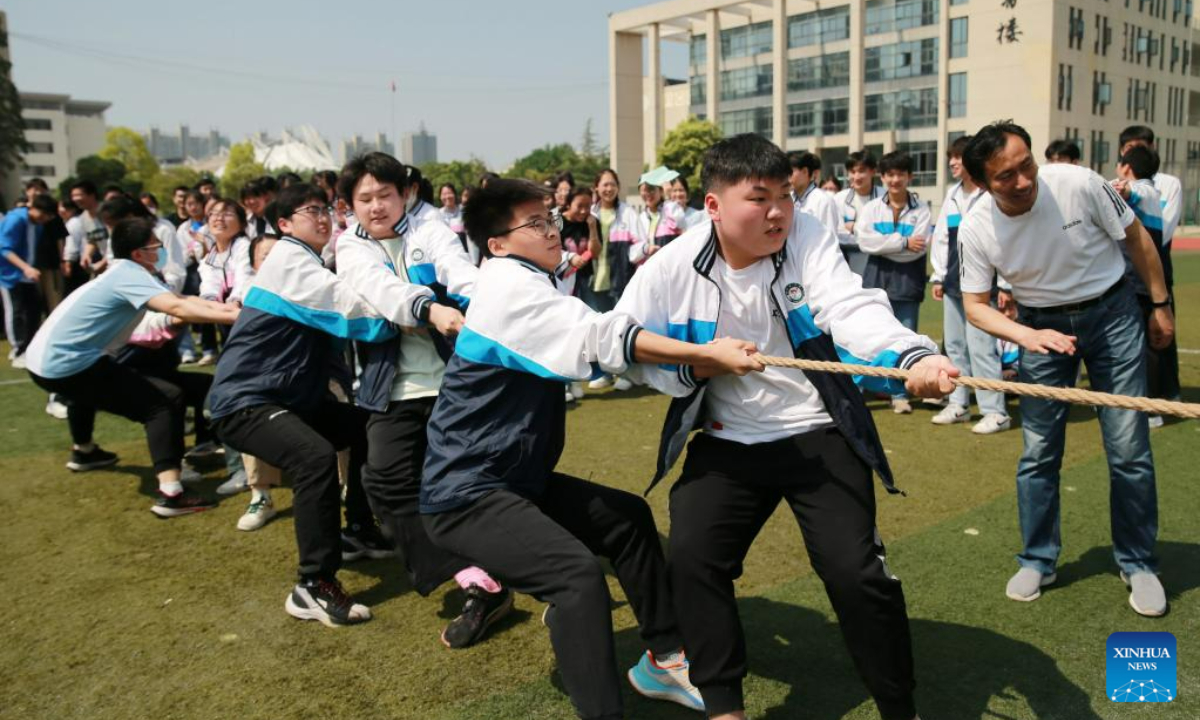 High school seniors take part in a stress relief game in Huaibei, east China's Anhui Province, May 31, 2023. As this year's college entrance exam approaches, a high school in Huaibei organized a series of activities to help students release stress. Photo:Xinhua