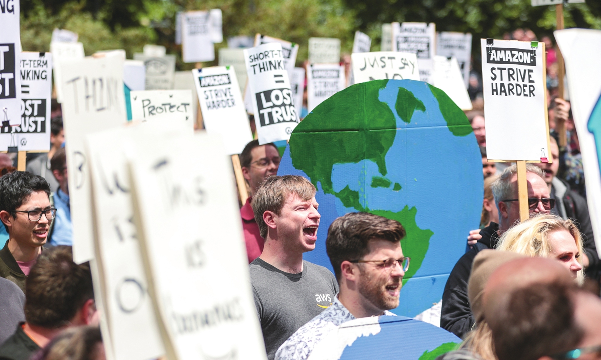 Amazon employees gather during a walk-out protest against recent layoffs, a return-to-office mandate, and the company's environmental impact, outside Amazon headquarters in Seattle, Washington, on May 31, 2023. Photo: AFP