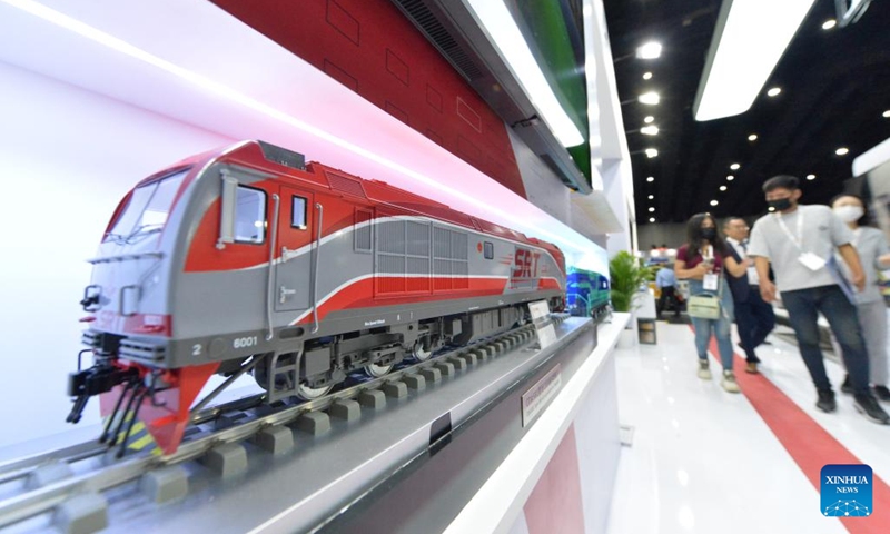 Visitors view the train models of China Railway Rolling Stock Corporation (CRRC) during Asia Pacific Rail 2023 in Bangkok, Thailand, on May 31, 2023. CRRC held a series of activities themed on Discovering the world by train during the exhibition, displaying diverse models of Chinese-made trains.(Photo: Xinhua)