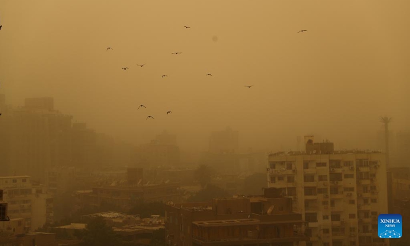 This photo taken on June 1, 2023 shows buildings shrouded in sand and dust during a sandstorm in Cairo, Egypt. A strong sandstorm hit the Egyptian capital city on Thursday afternoon.(Photo: Xinhua)