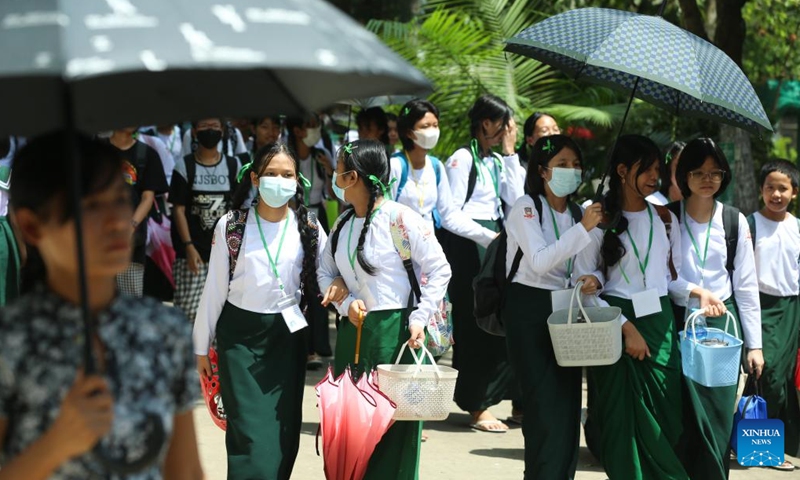 Students walk in a school compound on the first day of the new school year at a basic education high school in Yangon, Myanmar, June 1, 2023. A new school year with an updated curriculum for students of kindergarten to grade 12 in Myanmar kicked off on Thursday, said the Ministry of Education.(Photo: Xinhua)