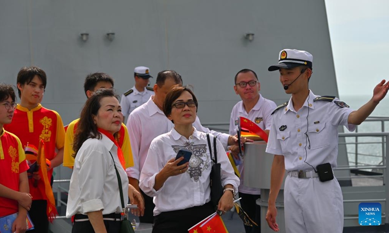 A Chinese navy member introduces Chinese naval training ship Qi Jiguang to visitors at Muara Port in Brunei, June 5, 2023.(Photo: Xinhua)