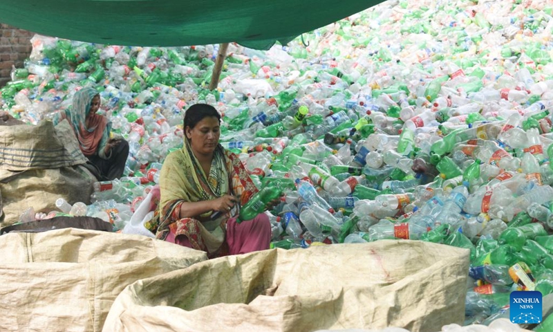 Workers check recycled plastic bottles at a recycle workshop in Lahore, Pakistan on June 5, 2023. Pakistani Prime Minister Shahbaz Sharif has emphasized the urgent need to combat plastic pollution under the global theme solutions to plastic pollution, in marking World Environment Day. (Photo by Sajjad/Xinhua)(Photo: Xinhua)