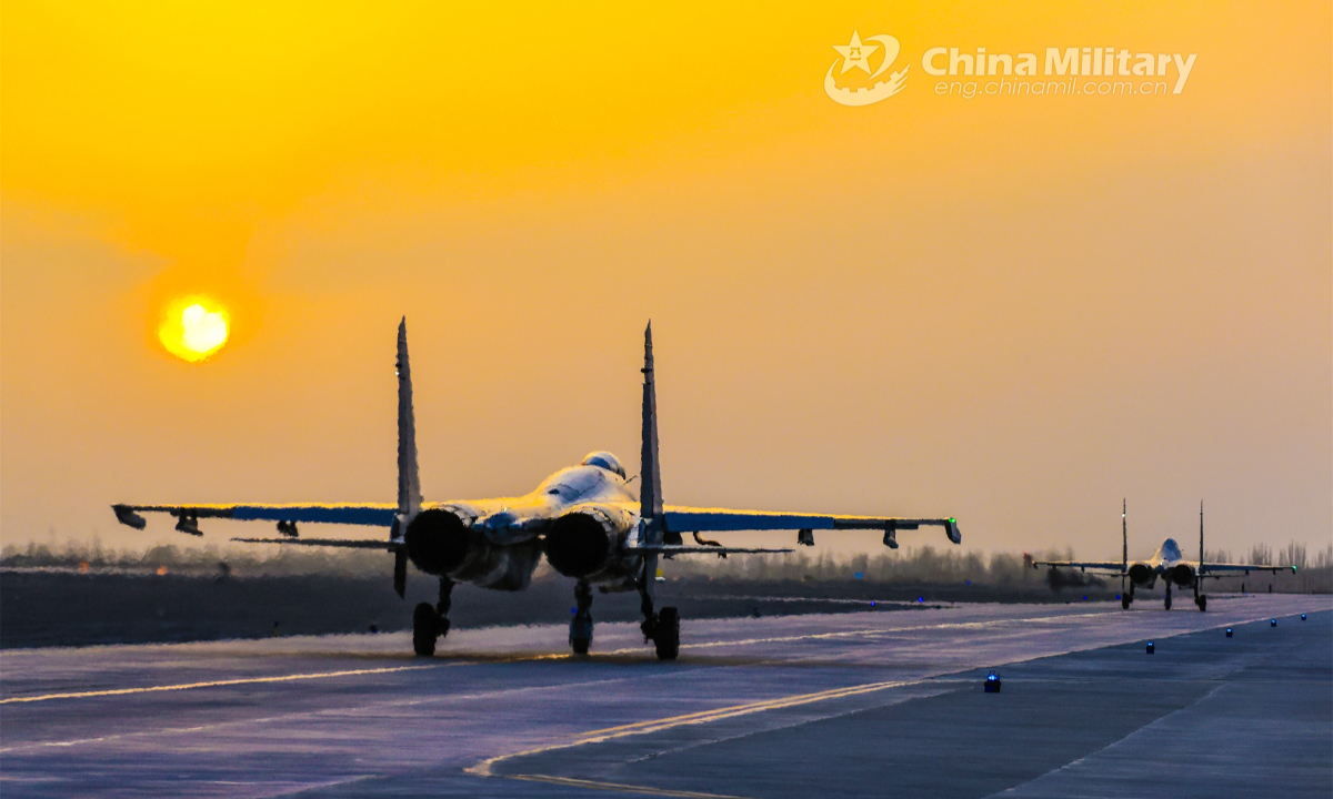 Fighter jets attached to a brigade under the PLA Air Force Xi'an Flying College taxi on the runway during a round-the-clock training mission in early June, 2023. Photo: China Military