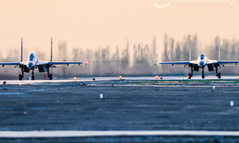 Fighter jets attached to a brigade under the PLA Air Force Xi'an Flying College taxi on the runway during a round-the-clock training mission in early June, 2023. (eng.chinamil.com.cn/Photo by Cui Baoliang)