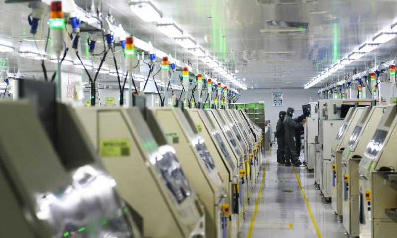 Employees work at an intelligent workshop of Lightning optoelectronic Co., Ltd. in Anxi County of Quanzhou, southeast China's Fujian Province, June 16, 2023. In recent years, Quanzhou has strengthened scientific and technological innovation, and guided enterprises to adopt new technologies and materials to drive high-quality and sustainable development. (Xinhua/Liu Yongzhen)