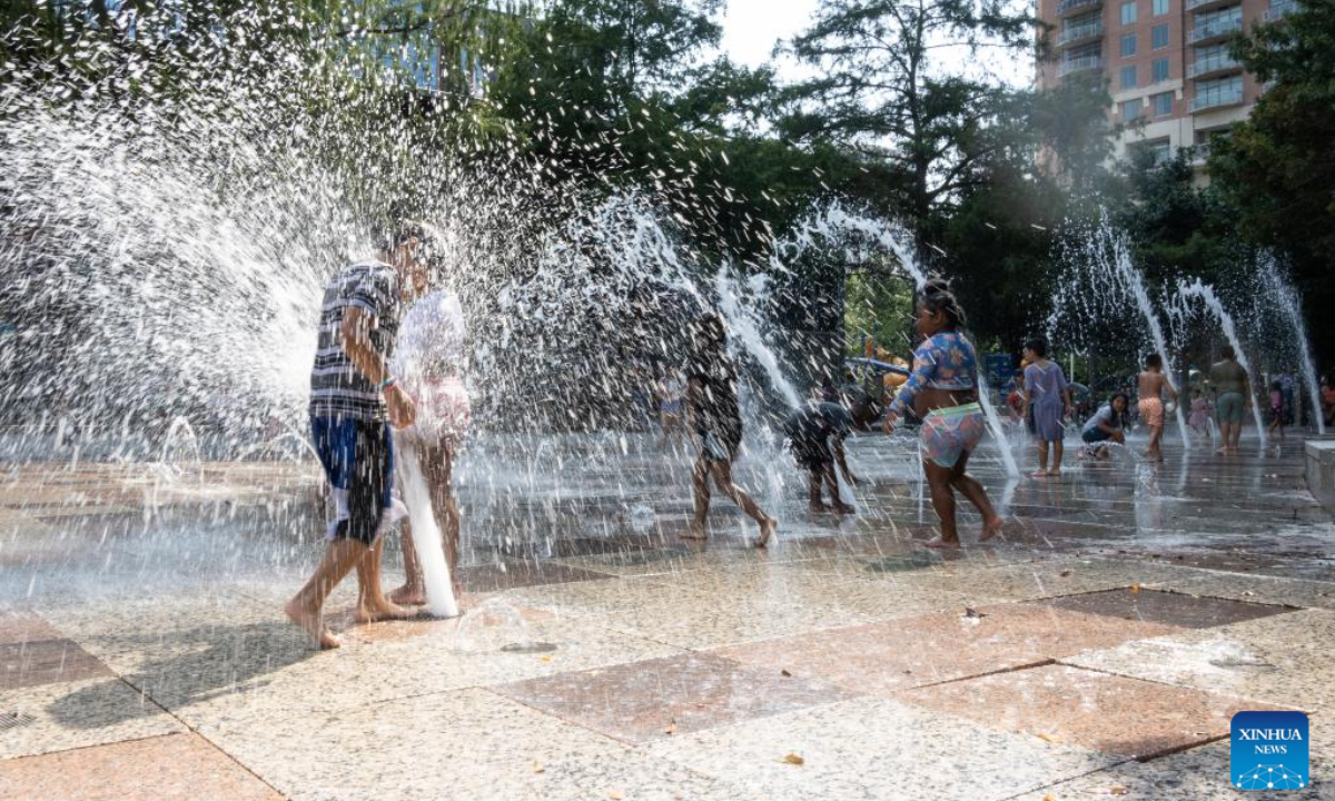 Children play and cool off at a splash park in downtown Houston, Texas, United States, on June 15, 2023. From US south central state of Texas to southeastern Florida, about 35 million people are bracing for a widespread heat wave which is expected to last for days, the US National Weather Service (NWS) forecast on Thursday. Photo:Xinhua