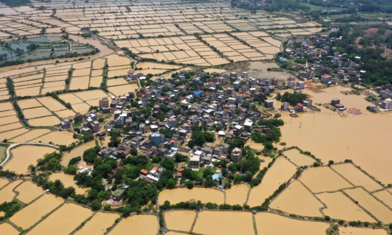 This aerial photo taken on June 11, 2023 shows villages affected by recent rainstorms in Baisha Town of Hepu County, south China's Guangxi Zhuang Autonomous Region. (Xinhua/Lu Boan)