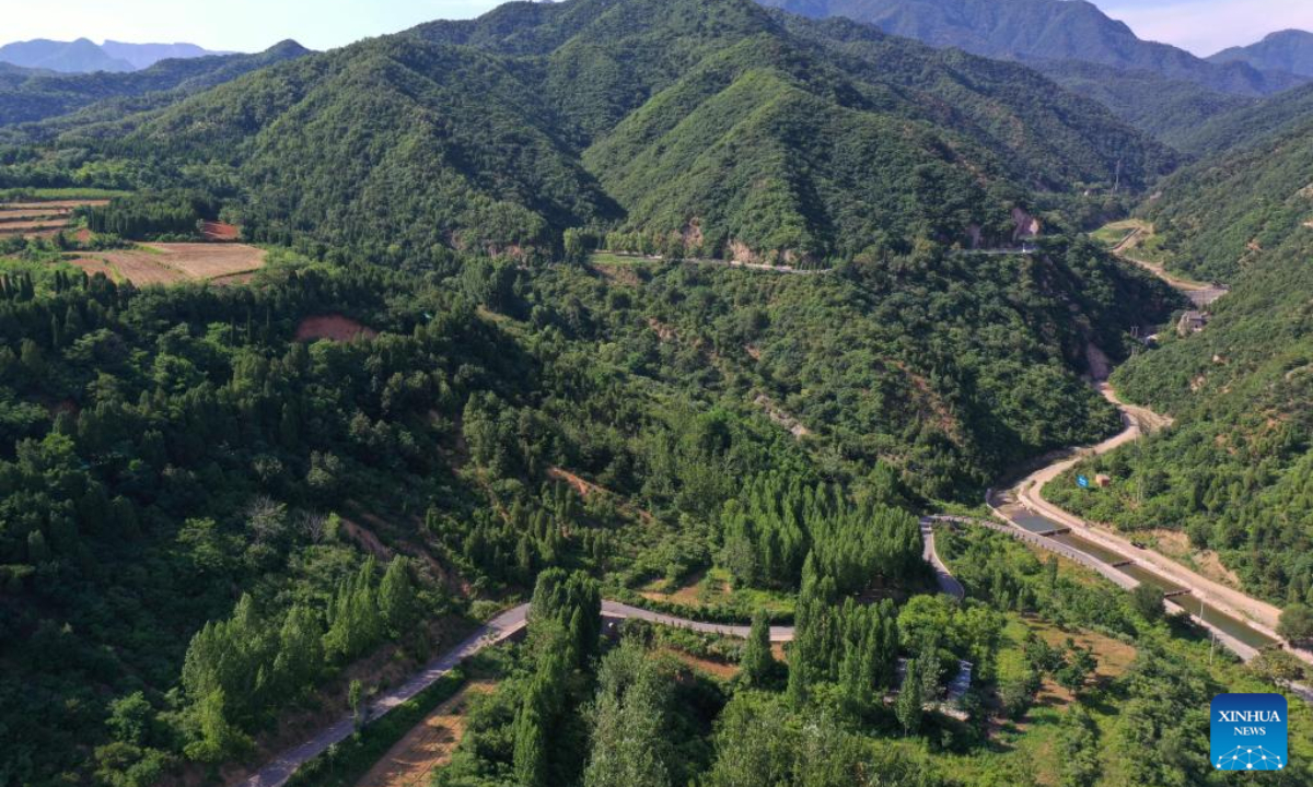 This aerial photo taken on June 15, 2023 shows a view of the Wangwu Mountain scenic spot in Jiyuan City, central China's Henan Province. Wangwu Mountain is located in Jiyuan City, Henan Province, where the ancient Chinese fable 