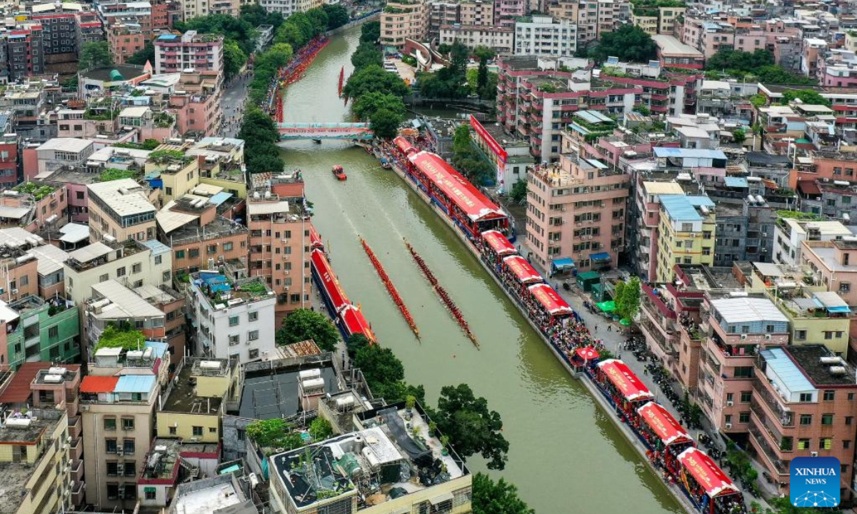 People take part in a dragon boat racing in Guangzhou, south China's Guangdong Province, June 15, 2023. Photo:Xinhua