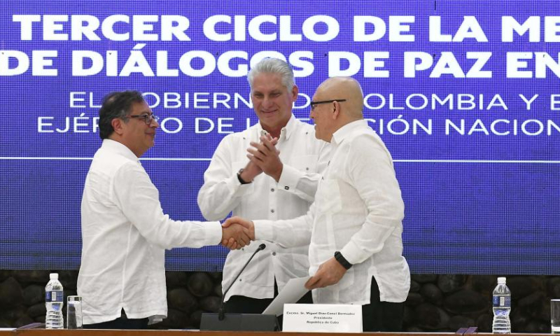 Cuban President Miguel Diaz-Canel (C) applauds as Colombian President Gustavo Petro (L) shakes hands with the first commander of the National Liberation Army Antonio Garcia (R) at the closing ceremony of the third round of peace talks between the Colombian government and the guerrilla group National Liberation Army in Havana, Cuba, June 9, 2023.(Photo by Joaquin Hernandez/Xinhua)