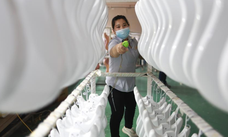 A worker processes guitar moulds at the Zheng'an Guitar Industrial Park in Zheng'an County, southwest China's Guizhou Province, June 7, 2023.

Zheng'an County is dubbed as a guitar manufacturing center in China. Zheng'an Guitar Industrial Park is an industrial cluster with standardized factories covering over 800,000 square meters and 126 guitar and guitar-related accessories manufacturers. More than six million guitars are produced here annually. (Xinhua/Liu Xu)