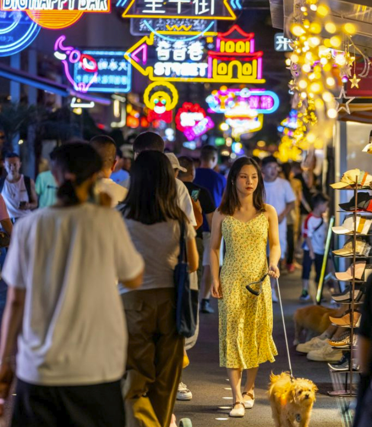 People walk in a street in Chengdu, southwest China's Sichuan Province, June 11, 2023. Chengdu, a historical city in southwest China's Sichuan Province, is home to treasured cultural and historical sites, including Sanxingdui Ruins, Jinsha Site Museum, and Dujiangyan irrigation system. In recent years, Chengdu has witnessed the rapid development of its cultural and creative industry, showcasing its vitality, creativeness and energy. (Xinhua/Shen Bohan)