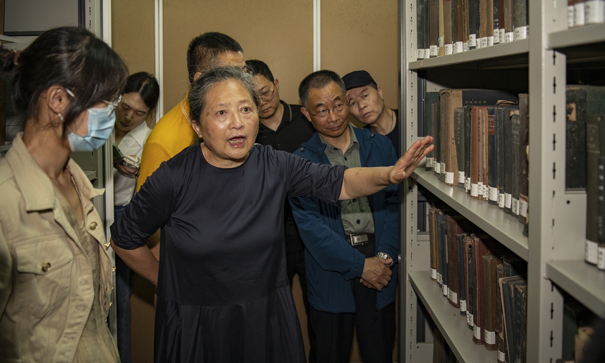 Wang Xuan (center), a representative of Chinese victims of?Japan's germ warfare during the War of Resistance against Japanese Aggression (1931-45), donates 11,378 precious archival items to an exhibition hall in Jinhua, East China's Zhejiang Province on June 7, 2023. Many of the donated items are first-hand original investigation materials with high historical value, including tapes, disks, research books and overseas documents. Photo: VCG