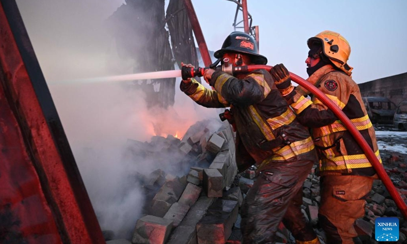 Firefighters battle a fire at a warehouse in Jahra Governorate, Kuwait, on June 12, 2023.(Photo: Xinhua)