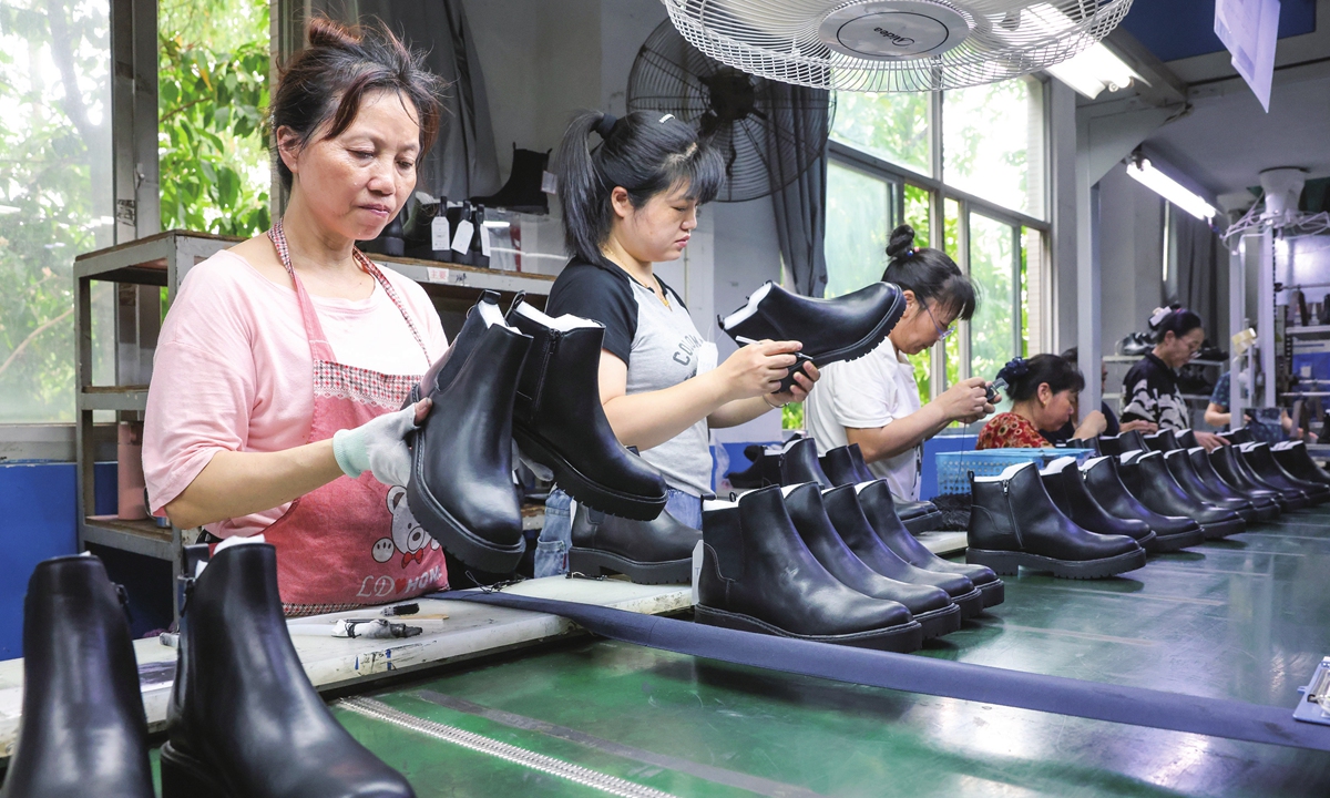 Workers are busy with working on the production line of a shoe company in Cangshan district, Fuzhou, East China's Fujian Province on June 7, 2023. Since the beginning of this year, Cangshan has continued to optimize local business environment and support exporters to explore overseas markets.
Photo: cnsphoto