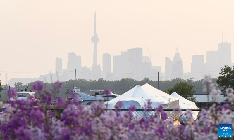 Wildfire smoke shrouds Toronto, Canada, on June 6, 2023. Environment Canada issued a special air quality statement for Toronto on Tuesday after the smoke from forest fires in Quebec and northeastern Ontario arrived in Toronto. Poor air quality may persist through most of this week.(Photo: Xinhua)