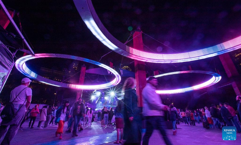 People enjoy light installations during the Vivid Sydney light festival in Sydney, Australia, June 7, 2023. As one of Sydney's most iconic events, Vivid Sydney is held from May 26 to June 17 this year, celebrating the soul of Sydney with illuminations, installations and interactive even(Photo: Xinhua)