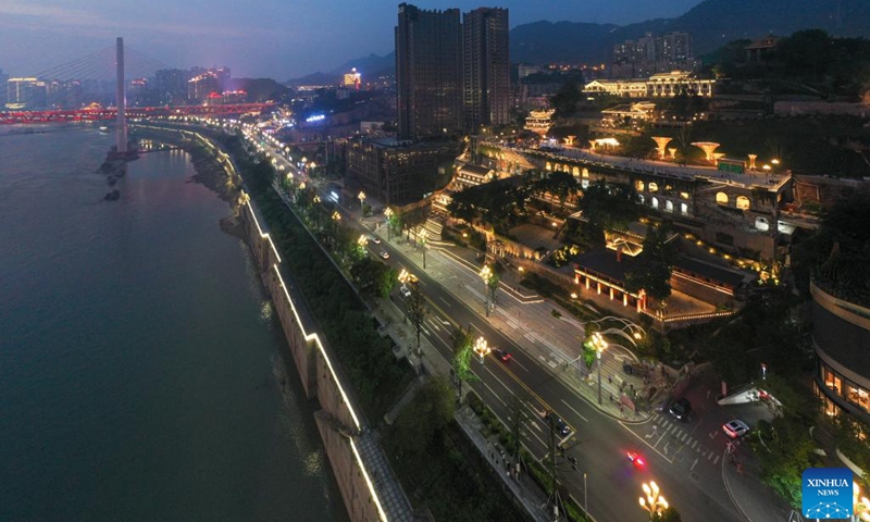 This aerial photo shows the night view in Chongqing's Opening Port Heritage Park in southwest China's Chongqing, June 9, 2023. A three-floor western building covered by traditional Chinese roof ridges glimmers in Chongqing's Opening Port Heritage Park on the south bank of Yangtze River in southwest China's Chongqing Municipality.(Photo: Xinhua)