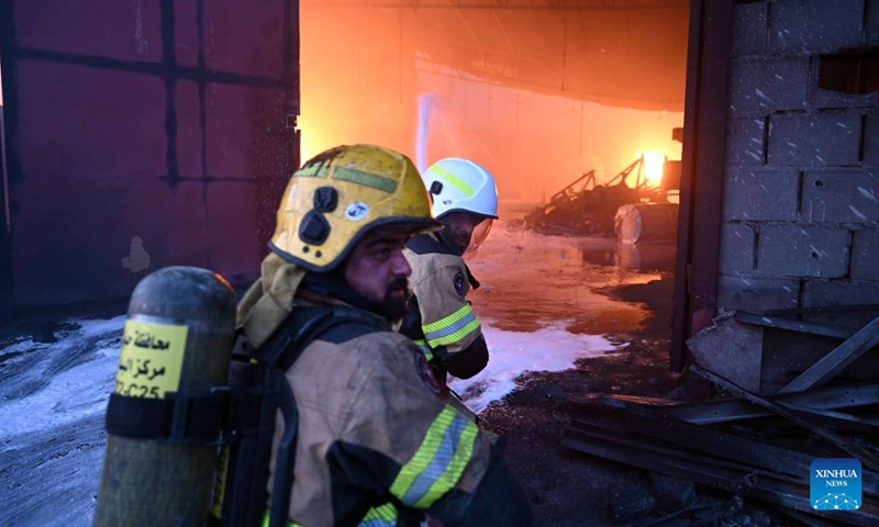 Firefighters battle a fire at a warehouse in Jahra Governorate, Kuwait, on June 12, 2023(Photo: Xinhua)