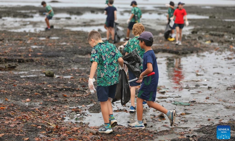 Students collect trash at a beach in Suva, Fiji, June 7, 2023. Students and staff members from a school in Suva took part in a beach cleanup activity on Wednesday to mark the annual World Oceans Day which falls on June 8.(Photo: Xinhua)