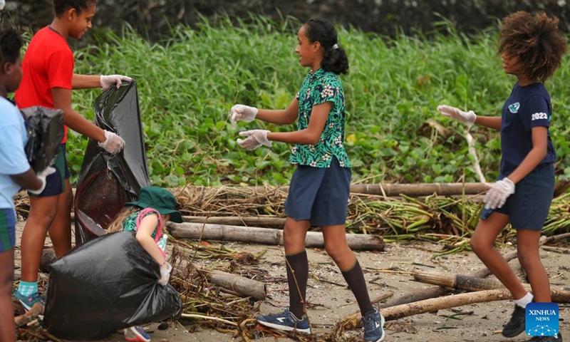 Students collect trash at a beach in Suva, Fiji, June 7, 2023. Students and staff members from a school in Suva took part in a beach cleanup activity on Wednesday to mark the annual World Oceans Day which falls on June 8.(Photo: Xinhua)