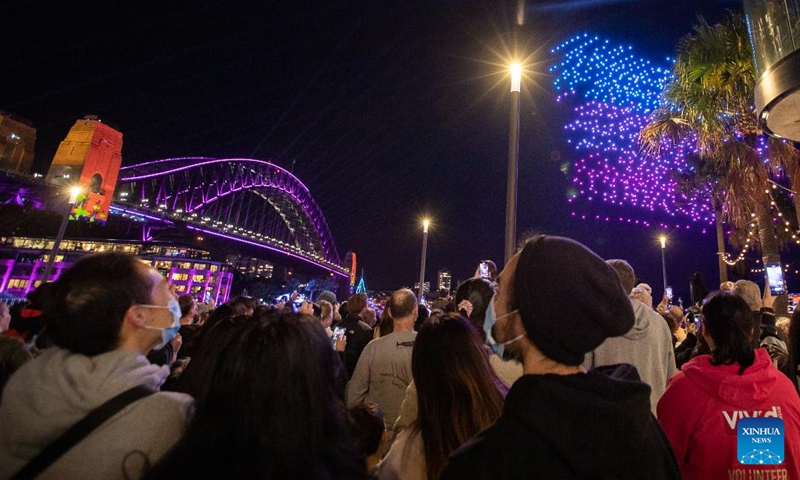 People watch a drone show during the Vivid Sydney light festival in Sydney, Australia, June 7, 2023. As one of Sydney's most iconic events, Vivid Sydney is held from May 26 to June 17 this year, celebrating the soul of Sydney with illuminations, installations and interactive events.(Photo: Xinhua)