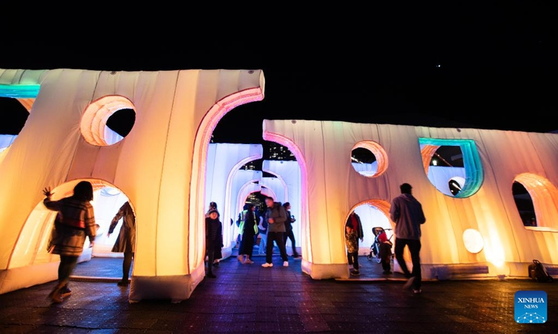 People enjoy light installations during the Vivid Sydney light festival in Sydney, Australia, June 7, 2023. As one of Sydney's most iconic events, Vivid Sydney is held from May 26 to June 17 this year, celebrating the soul of Sydney with illuminations, installations and interactive events.(Photo: Xinhua)