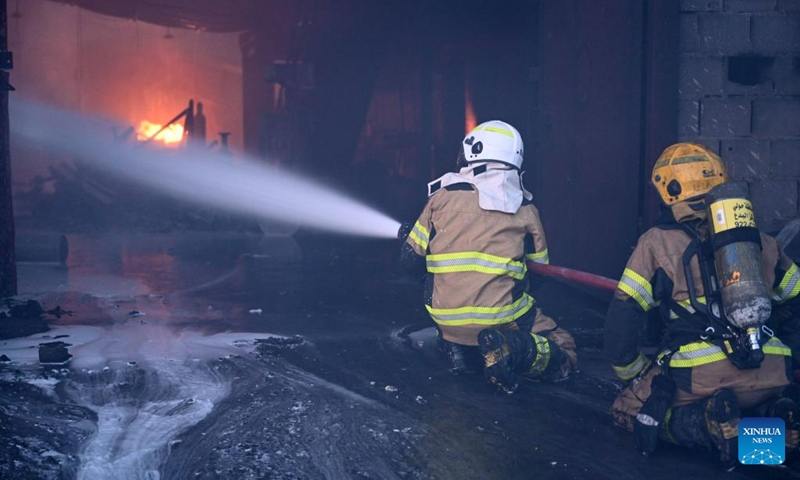 Firefighters battle a fire at a warehouse in Jahra Governorate, Kuwait, on June 12, 2023.(Photo: Xinhua)