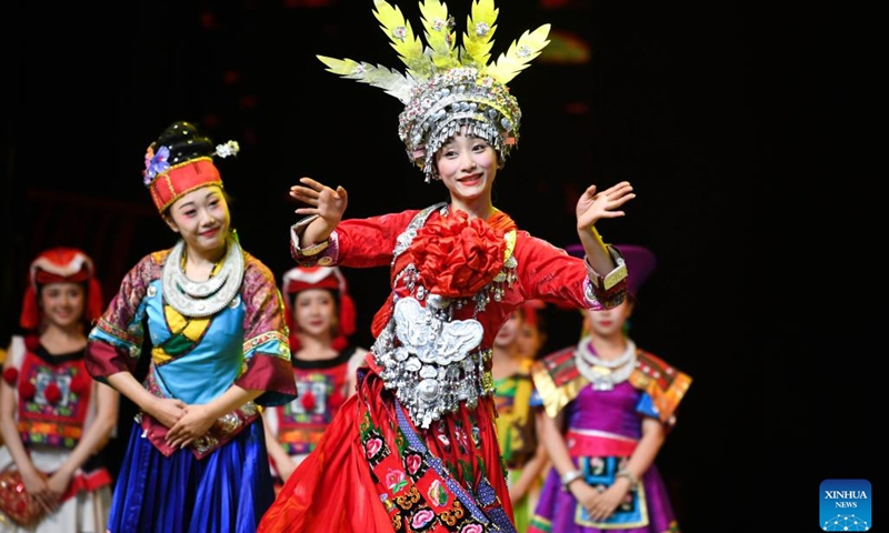 Actors perform in the show Colorful Guizhou Style at Guiyang Grand Theatre in Guiyang, southwest China's Guizhou Province, June 5, 2023. The Colorful Guizhou Style show, which debuted in 2006, has been performed in over 40 countries or regions worldwide and seen by over 10 million people. The show illustrates the vibrant ethnic culture of Guizhou and the hospitable people living there.(Photo: Xinhua)