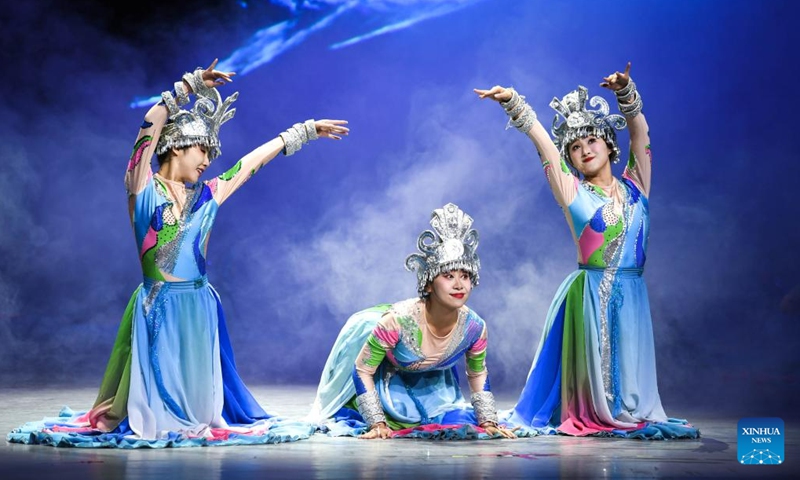 Actors perform in the show Colorful Guizhou Style at Guiyang Grand Theatre in Guiyang, southwest China's Guizhou Province, June 5, 2023. The Colorful Guizhou Style show, which debuted in 2006, has been performed in over 40 countries or regions worldwide and seen by over 10 million people. The show illustrates the vibrant ethnic culture of Guizhou and the hospitable people living there.(Photo: Xinhua)