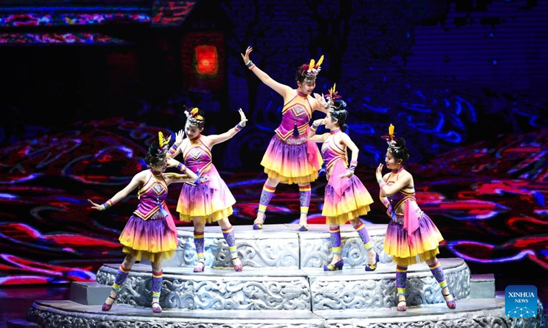 Actors perform in the show Colorful Guizhou Style at Guiyang Grand Theatre in Guiyang, southwest China's Guizhou Province, June 5, 2023. The Colorful Guizhou Style show, which debuted in 2006, has been performed in over 40 countries or regions worldwide and seen by over 10 million people. The show illustrates the vibrant ethnic culture of Guizhou and the hospitable people living there.(Photo: Xinhua)