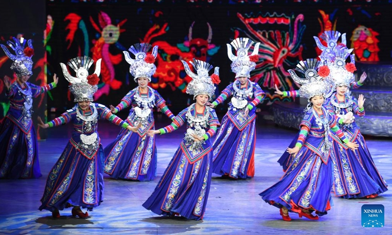 Actors perform in the show Colorful Guizhou Style at Guiyang Grand Theatre in Guiyang, southwest China's Guizhou Province, June 5, 2023. The Colorful Guizhou Style show, which debuted in 2006, has been performed in over 40 countries or regions worldwide and seen by over 10 million people. The show illustrates the vibrant ethnic culture of Guizhou and the hospitable people living there.(Photo: Xinhua)