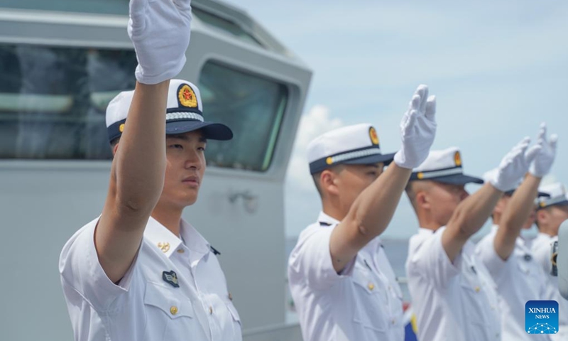 Crew members of Chinese naval training ship Qi Jiguang greet the people welcoming the ship at South Harbor in Manila, the Philippines, June 14, 2023(Photo: Xinhua)