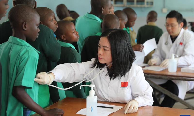 Chinese doctors give free medical examinations to children during a donation ceremony in Harare, Zimbabwe, June 13, 2023. The Chinese Embassy in Zimbabwe held a donation ceremony on Tuesday in Harare, capital of Zimbabwe, to bring cheer to orphans and other vulnerable children in the country.(Photo: Xinhua)