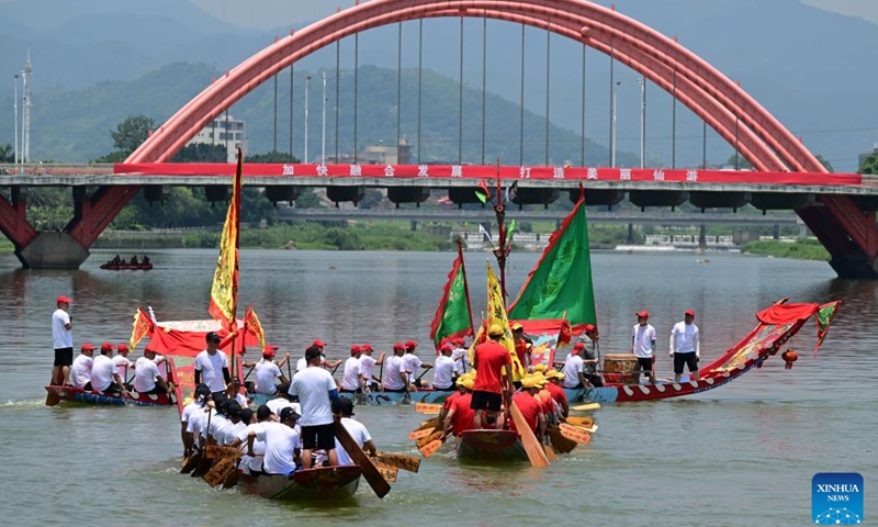 People row dragon boats during a cultural event to celebrate the upcoming Dragon Boat Festival in Putian, southeast China's Fujian Province, June 13, 2023. A series of cultural events is going to be held in Putian to celebrate the traditional Dragon Boat Festival, which falls on June 22 this year.(Photo: Xinhua)