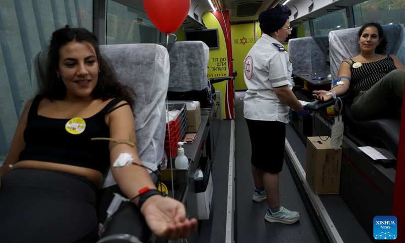 Volunteers donate blood on the occasion of World Blood Donor Day in central Israeli city of Modiin, on June 14, 2023.(Photo: Xinhua)