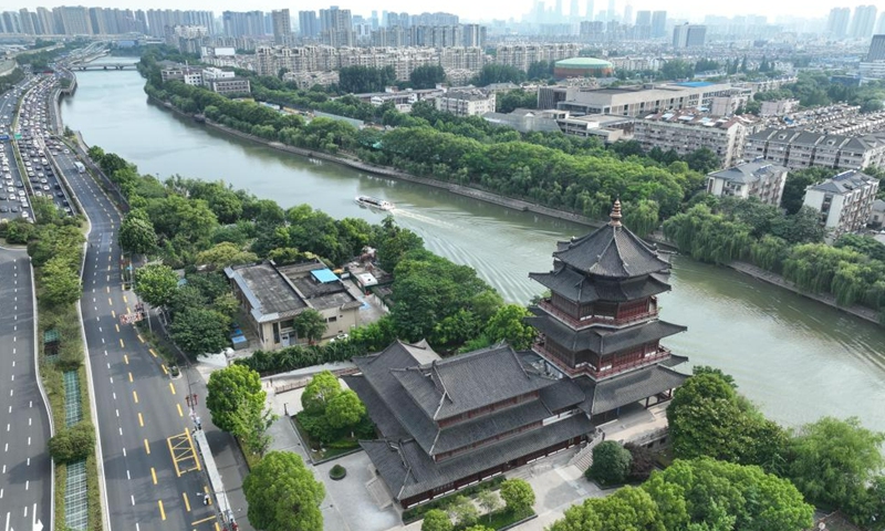 This aerial photo taken on June 10, 2023 shows a boat sailing on the Qinhuai River in Nanjing, east China's Jiangsu Province. Nanjing, the capital of six dynasties in ancient China, has rich cultural accumulation and unique cultural landscapes.(Photo: Xinhua)