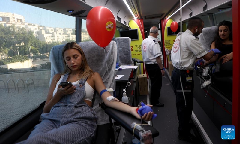 Volunteers donate blood on the occasion of World Blood Donor Day in central Israeli city of Modiin, on June 14, 2023.(Photo: Xinhua)