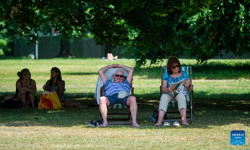 People rest on deckchairs in the shade of trees at Hyde Park in London, Britain, on June 15, 2023. Parts of Britain are in the grip of a heatwave currently.(Photo: Xinhua)