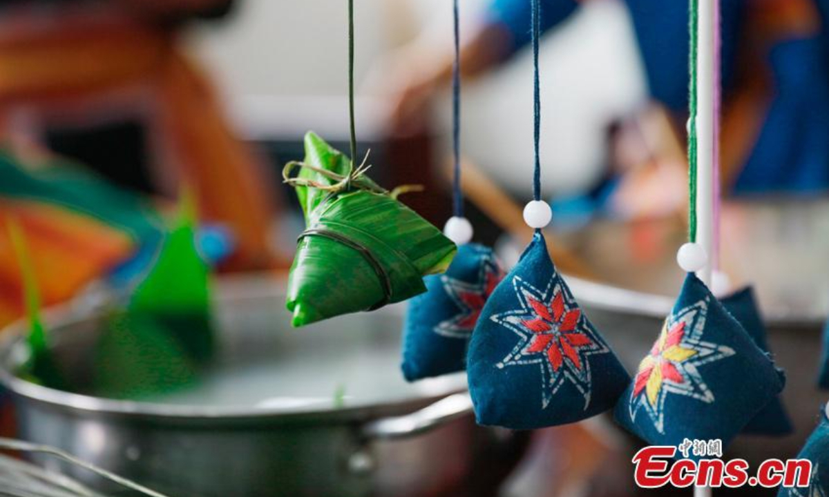 Women of Miao ethnic group make pyramid-shaped sachets ahead of the Dragon Boat Festival in Jianzhu Miao Township, Gulin County of Luzhou City, southwest China's Sichuan Province. Photo: China News Service