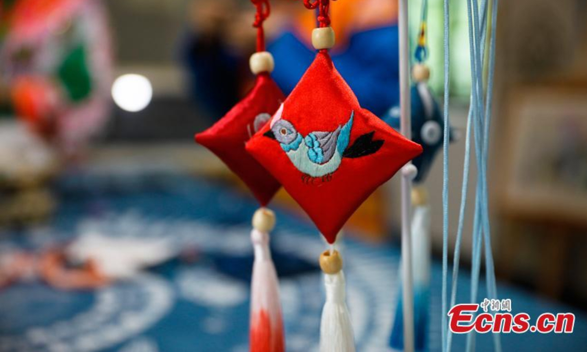 Women of Miao ethnic group make pyramid-shaped sachets ahead of the Dragon Boat Festival in Jianzhu Miao Township, Gulin County of Luzhou City, southwest China's Sichuan Province. Photo: China News Service